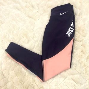 Nike XSmall purple and pink leggings; pink portion has color block detail
